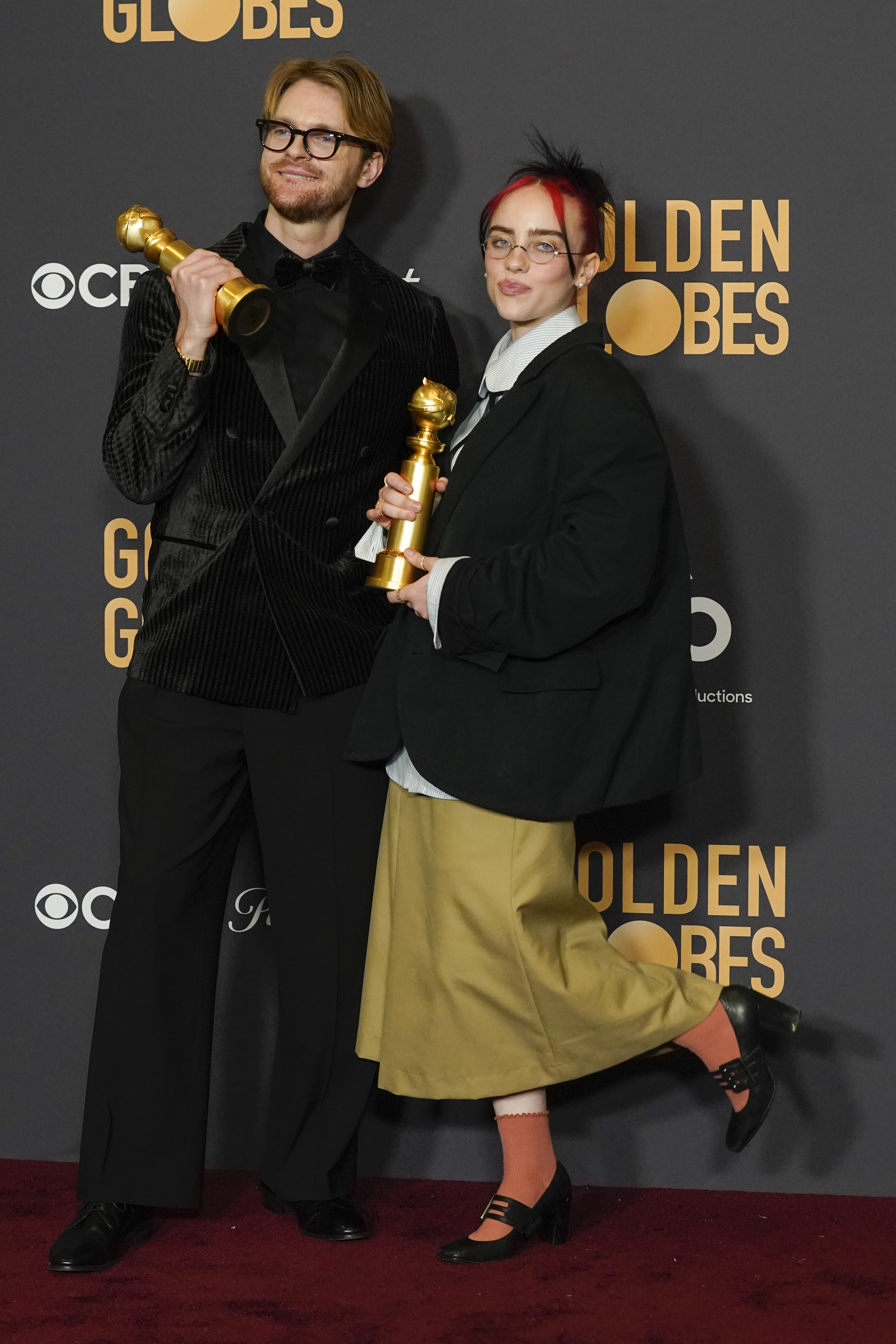 Finneas and Billie Eilish pose with the award for best original song, motion picture for "What Was I Made For?" from "Barbie" at the 81st Golden Globe Awards.